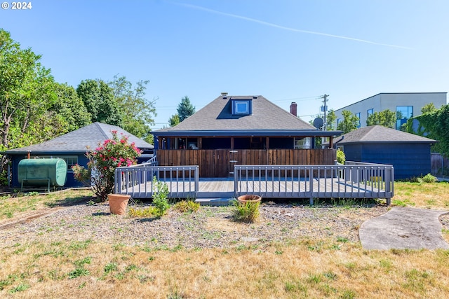 back of property featuring a wooden deck