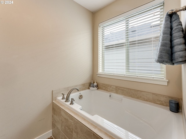 bathroom featuring tiled bath