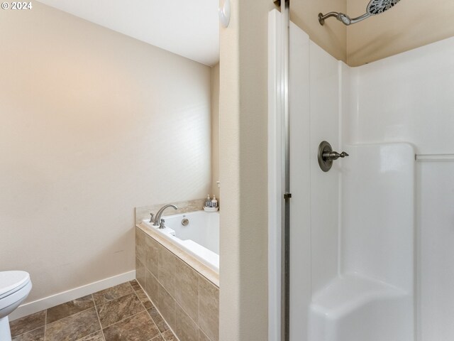 bathroom with tiled bath and toilet