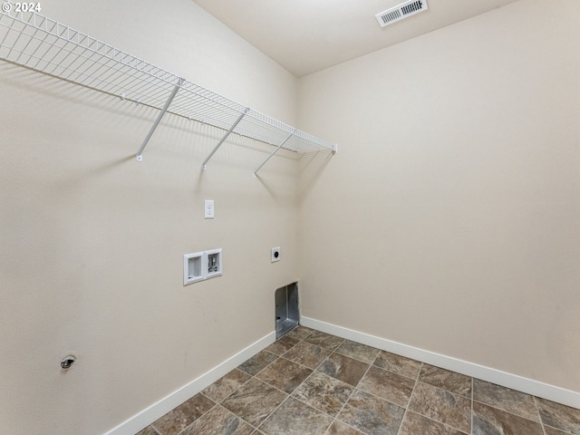 washroom with electric dryer hookup and hookup for a washing machine