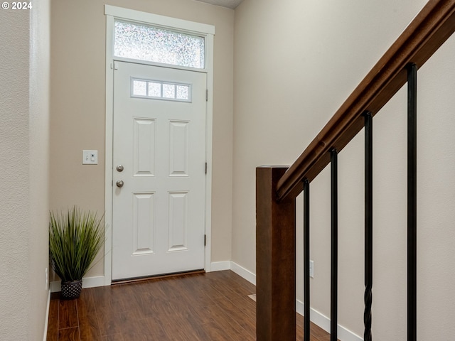 entrance foyer featuring dark hardwood / wood-style floors