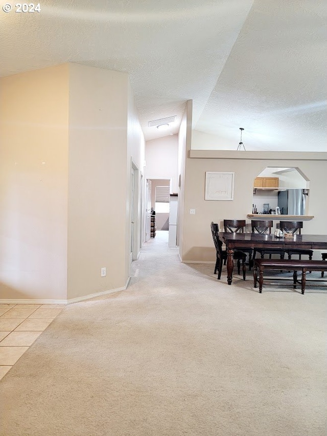 71823 Meadow Loop, Boardman, OR 97818 - dining area featuring carpet, a textured ceiling, and lofted ceiling