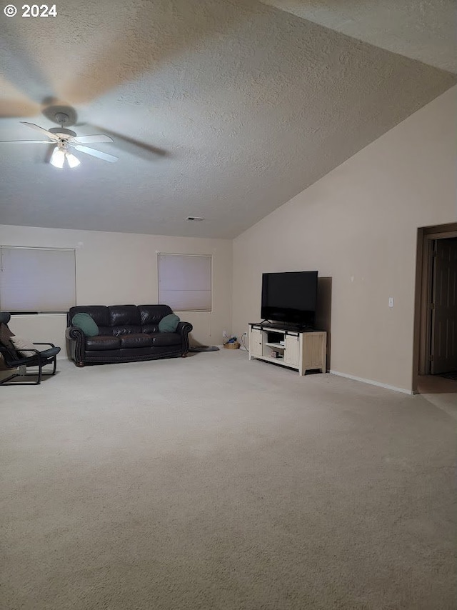 71823 Meadow Loop, Boardman, OR 97818 - carpeted living room with ceiling fan, lofted ceiling, and a textured ceiling