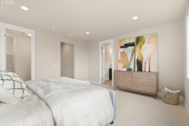 bedroom featuring recessed lighting, light carpet, and baseboards