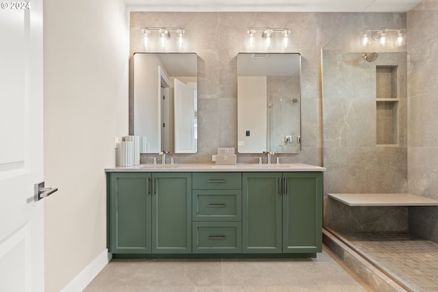 full bathroom with double vanity, a sink, tile walls, and walk in shower