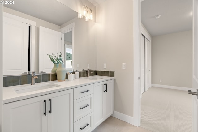 bathroom with tile patterned flooring and vanity