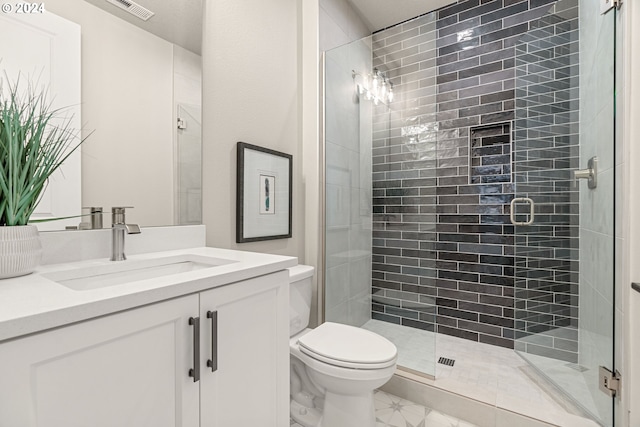 full bath featuring toilet, a shower stall, visible vents, and vanity