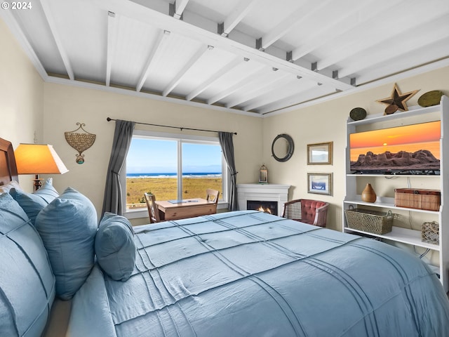 bedroom featuring beamed ceiling and ornamental molding