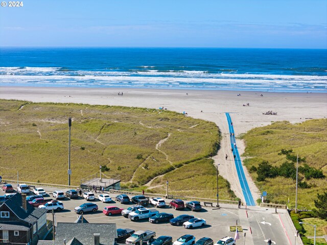 aerial view featuring a water view and a beach view