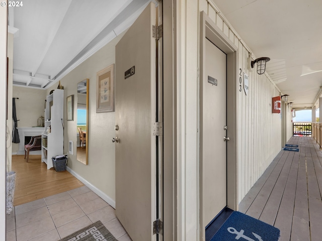 hallway with light hardwood / wood-style flooring