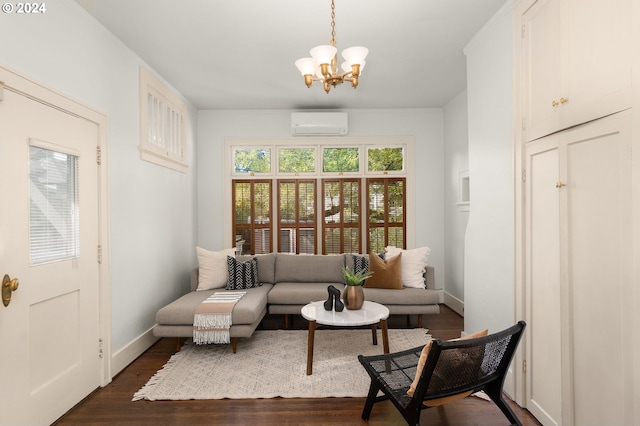 sitting room featuring dark wood-type flooring, a wall mounted AC, and a chandelier