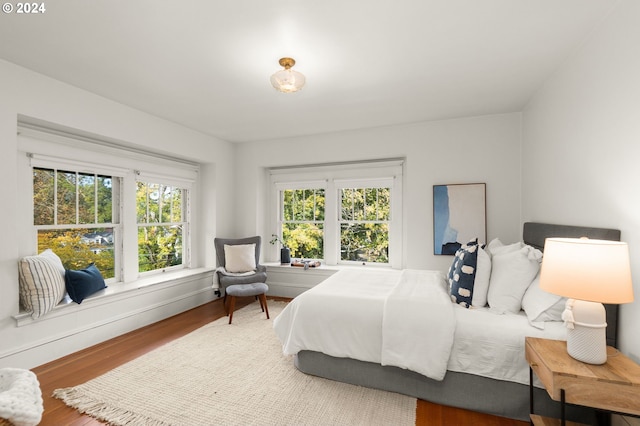 bedroom with wood-type flooring