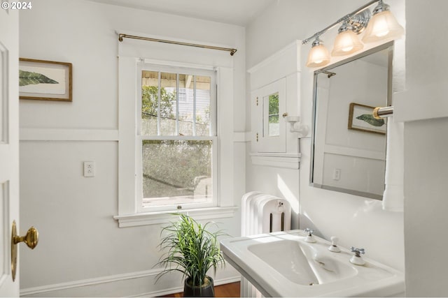 bathroom featuring sink and radiator heating unit