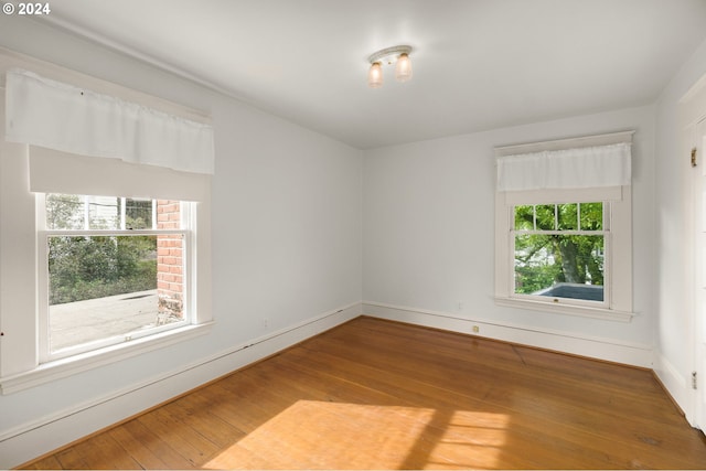 unfurnished room featuring wood-type flooring