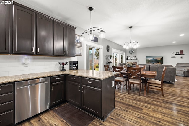 kitchen featuring an inviting chandelier, tasteful backsplash, stainless steel dishwasher, dark hardwood / wood-style floors, and pendant lighting