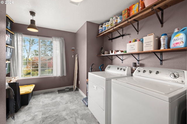 laundry area with washer and clothes dryer