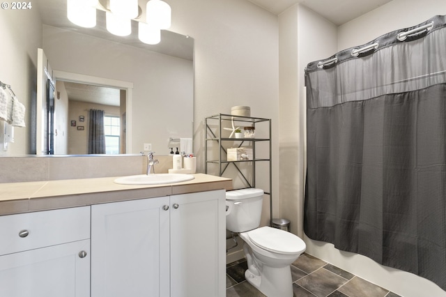 full bathroom with tile patterned floors, vanity, toilet, and shower / bathtub combination with curtain