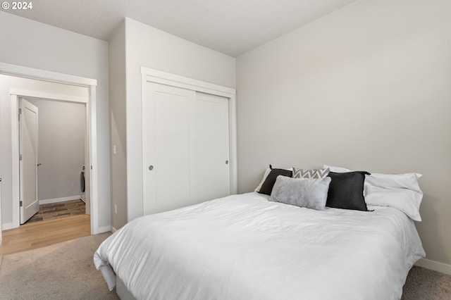 carpeted bedroom featuring a closet