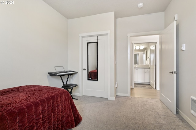 carpeted bedroom with a closet