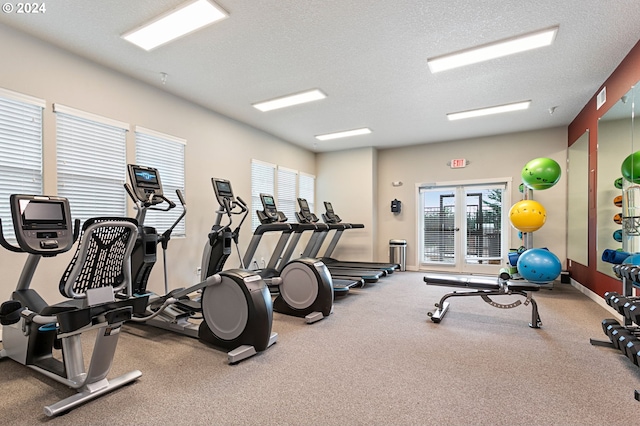 gym featuring a textured ceiling