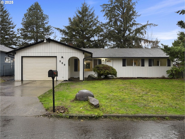 single story home with a front yard and a garage