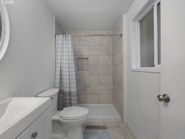 bathroom with vanity, toilet, and curtained shower