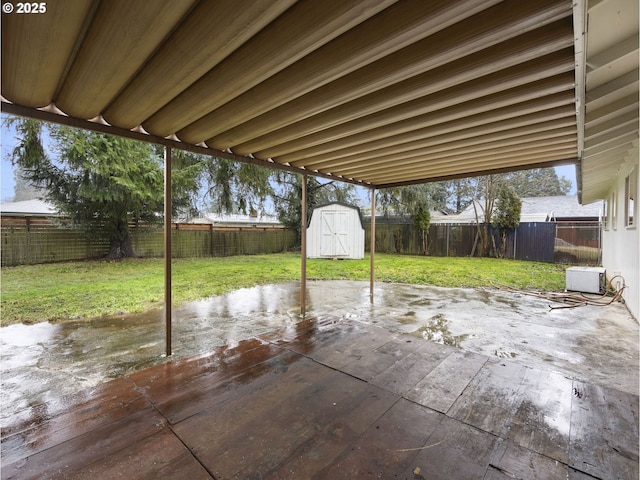 view of patio / terrace with a shed