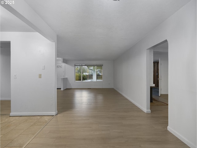 unfurnished living room with light hardwood / wood-style flooring