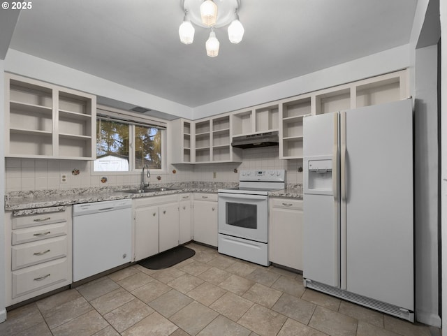 kitchen featuring light stone counters, sink, white cabinets, and white appliances