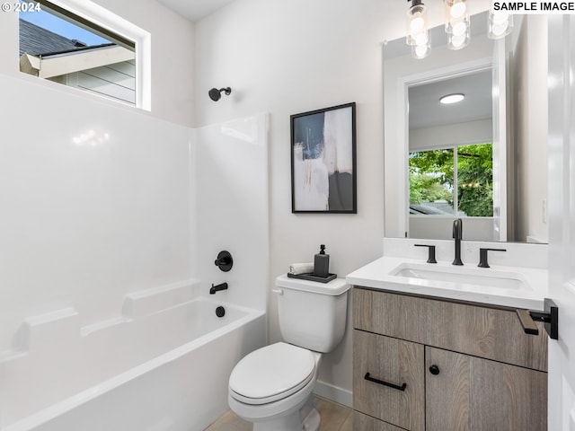 full bathroom with bathing tub / shower combination, vanity, and toilet