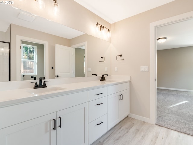 bathroom featuring wood-type flooring and vanity