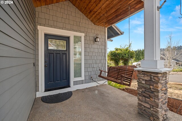 doorway to property with covered porch