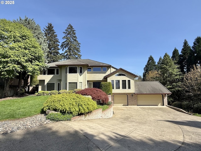 1519 NW 79th Cir, Vancouver, WA 98665 - view of front facade with concrete driveway, a garage, a front yard, and brick siding