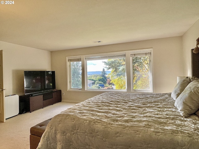 carpeted bedroom featuring a textured ceiling