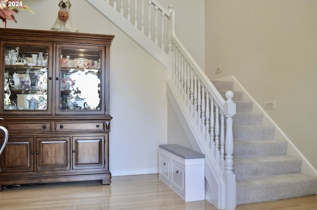 stairway featuring hardwood / wood-style floors