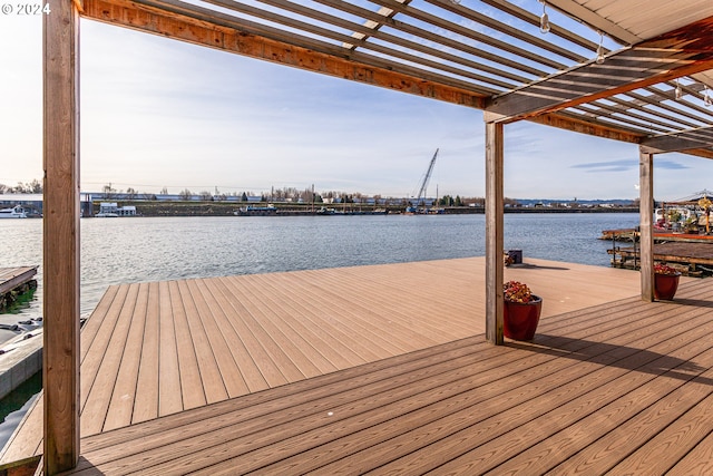 dock area with a pergola and a water view