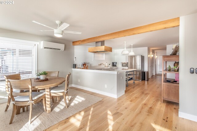 dining space with light hardwood / wood-style floors, a wall mounted AC, and ceiling fan