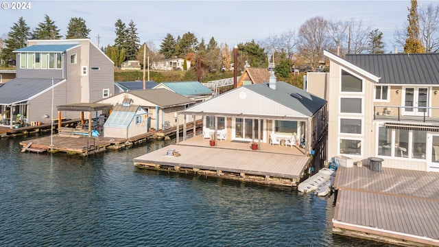 back of house featuring a water view