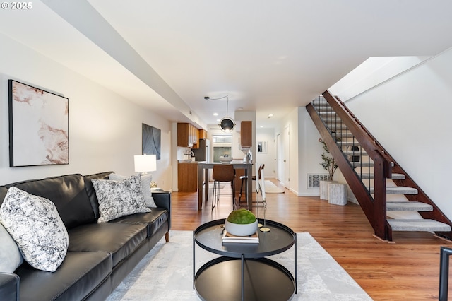 living room featuring light wood-type flooring