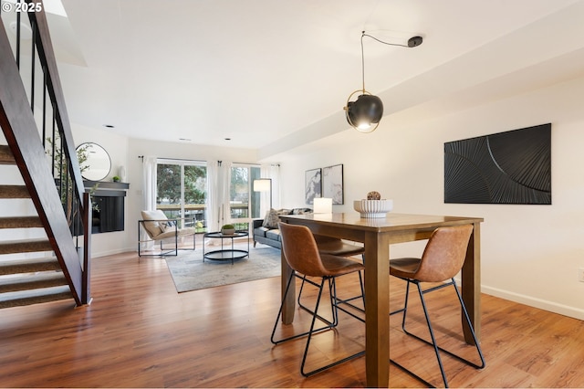 dining area with wood-type flooring