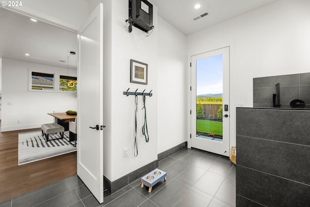 interior space featuring tile flooring and plenty of natural light