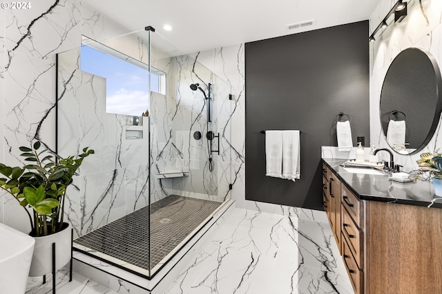 bathroom featuring tile flooring, separate shower and tub, and vanity