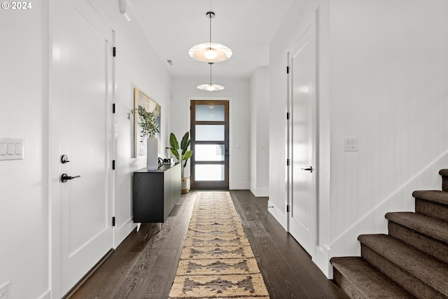 foyer with dark hardwood / wood-style floors