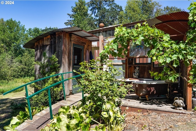 exterior space with a jacuzzi