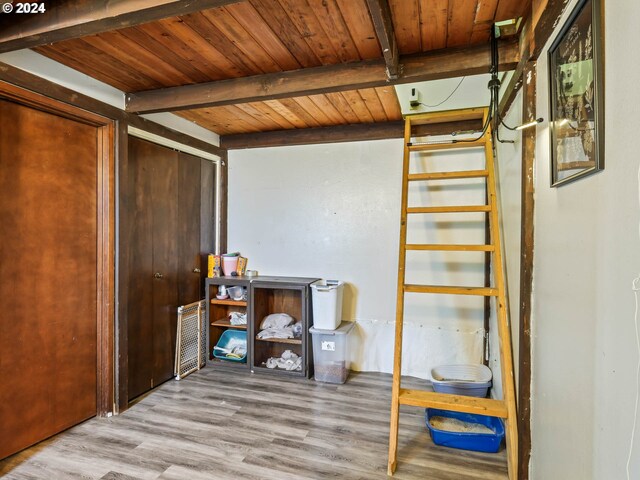 interior space with light wood-type flooring and wooden ceiling