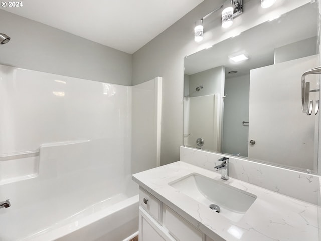 bathroom with shower / tub combination and vanity