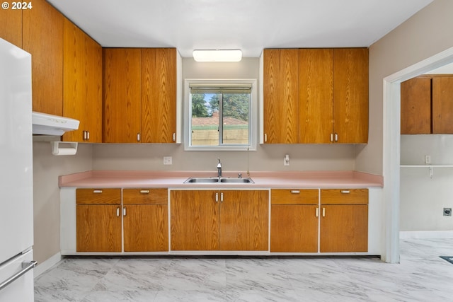 kitchen with white refrigerator and sink