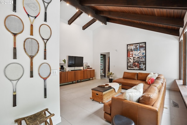 tiled living area featuring beam ceiling, high vaulted ceiling, and wooden ceiling