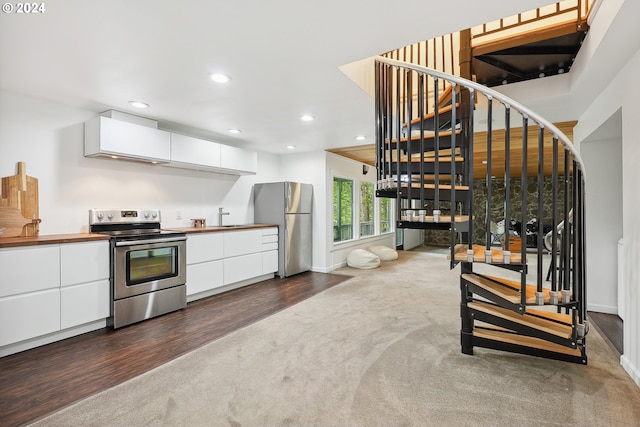 kitchen featuring white cabinets, dark hardwood / wood-style floors, sink, and appliances with stainless steel finishes