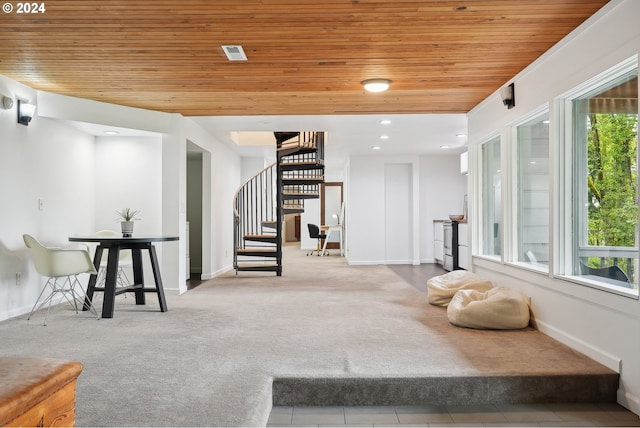 interior space with wooden ceiling, light colored carpet, and a healthy amount of sunlight